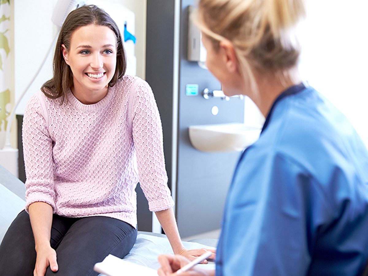 Patient smiling during a medical consultation.