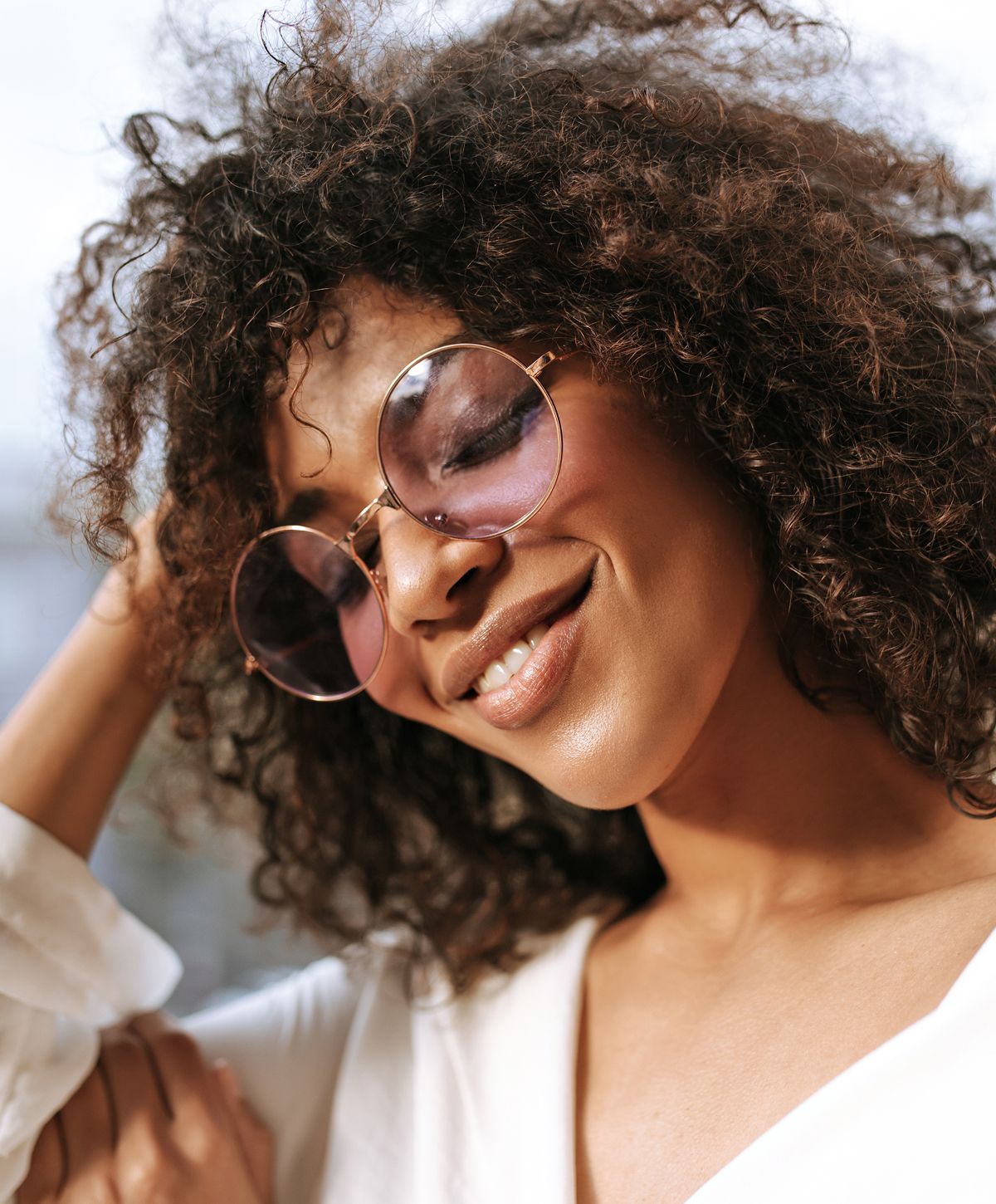 Confident woman in professional attire smiling.