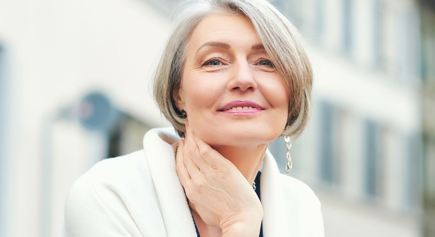Woman with blonde hair wearing a hat.