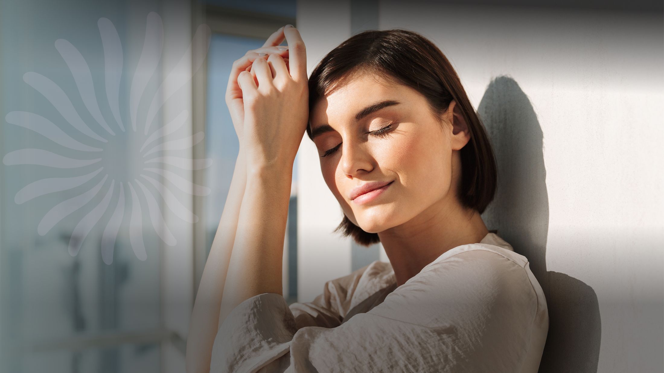 Woman enjoying sunlight with a peaceful expression.